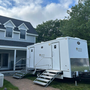 Luxury restroom trailer setup at a private residence wedding