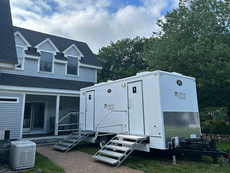 Luxury restroom trailer setup at a private residence wedding