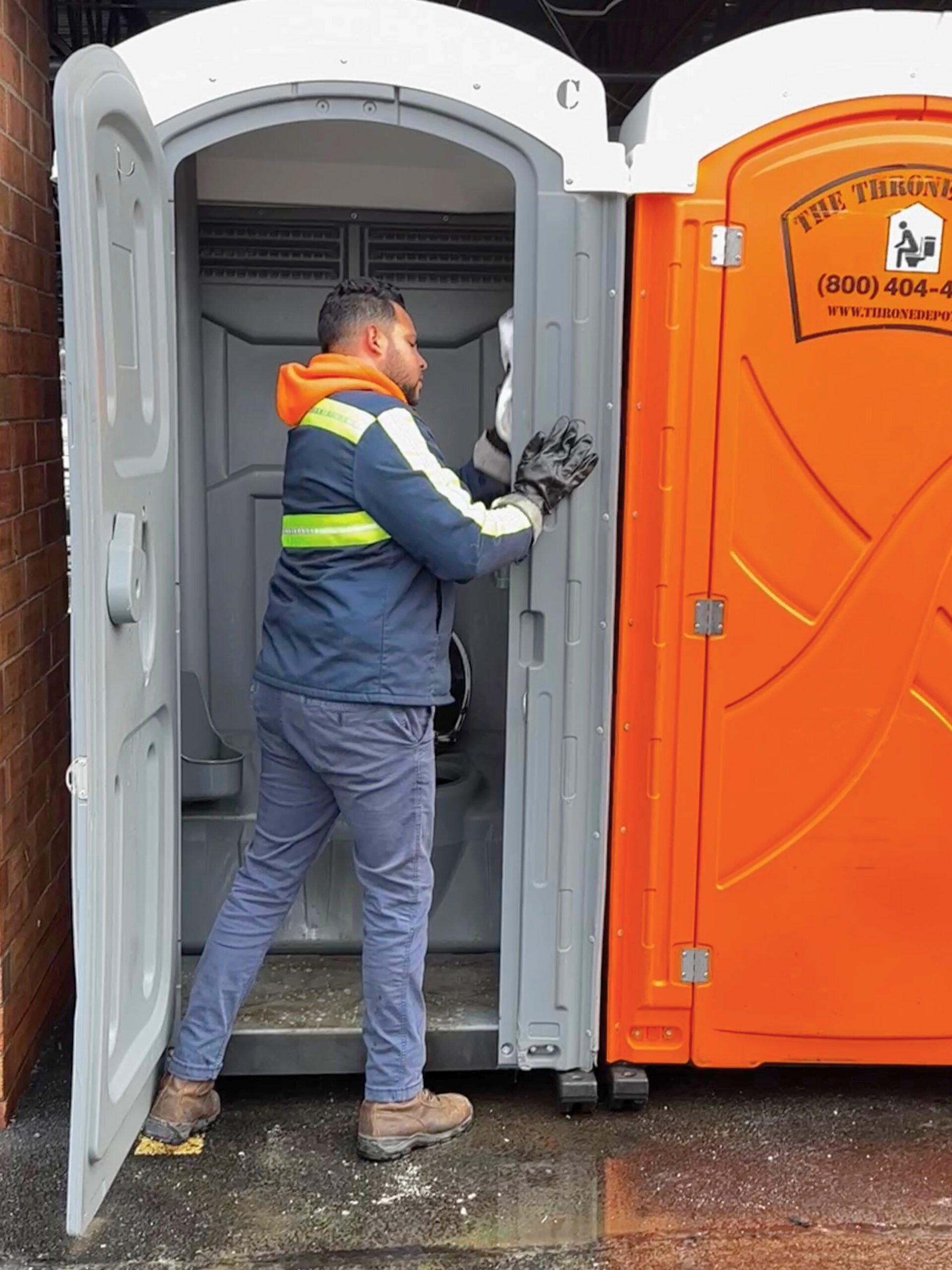 Portable toilet serviced onsite by The Throne Depot technician under SOCO guarantee