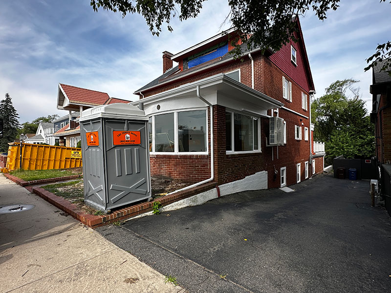 Porta potty and portable toilet rentals positioned at a residential home construction site