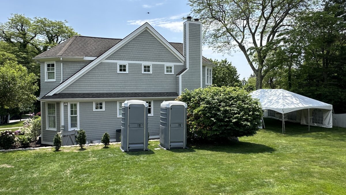Portable restroom set up for a backyard party to provide convenient and comfortable guest facilities