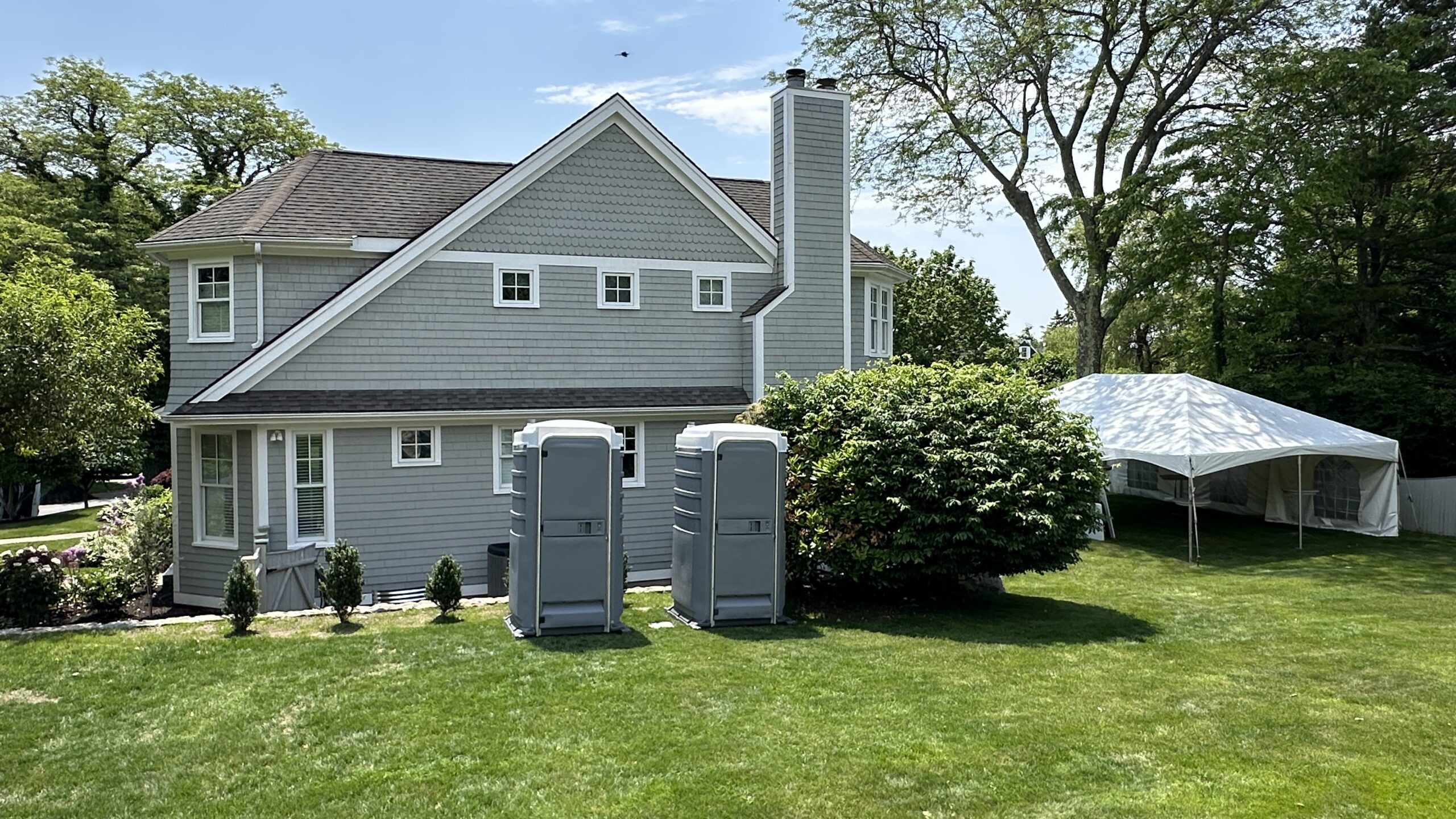 Portable restroom set up for a backyard party to provide convenient and comfortable guest facilities