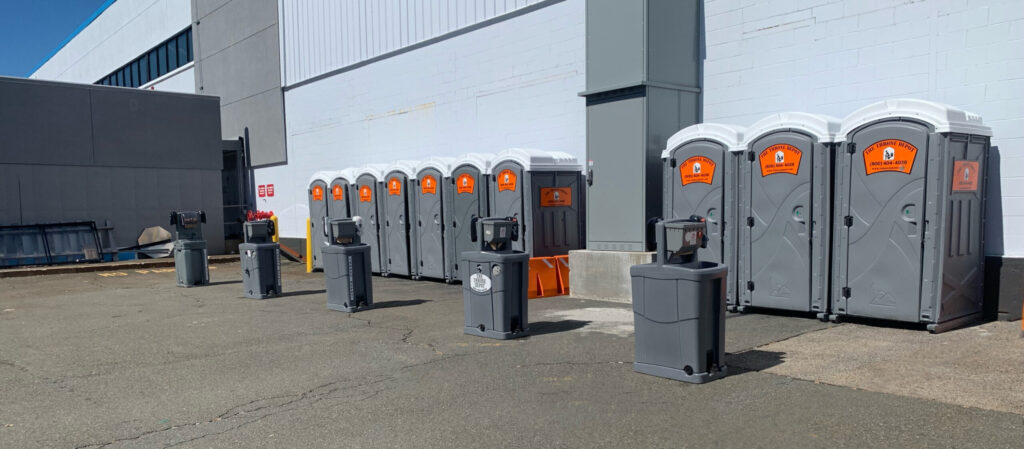 Portable restrooms on a construction site meeting OSHA restroom requirements for employers
