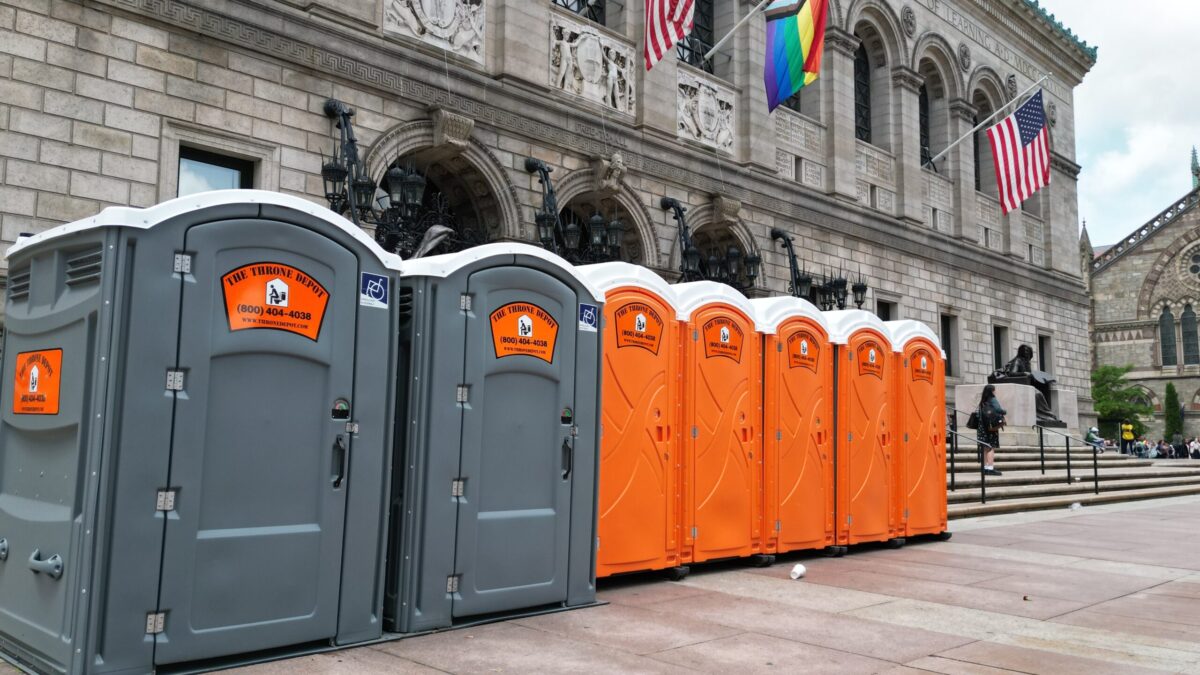 Row of standard portable toilets showing common options available for portable toilet rentals