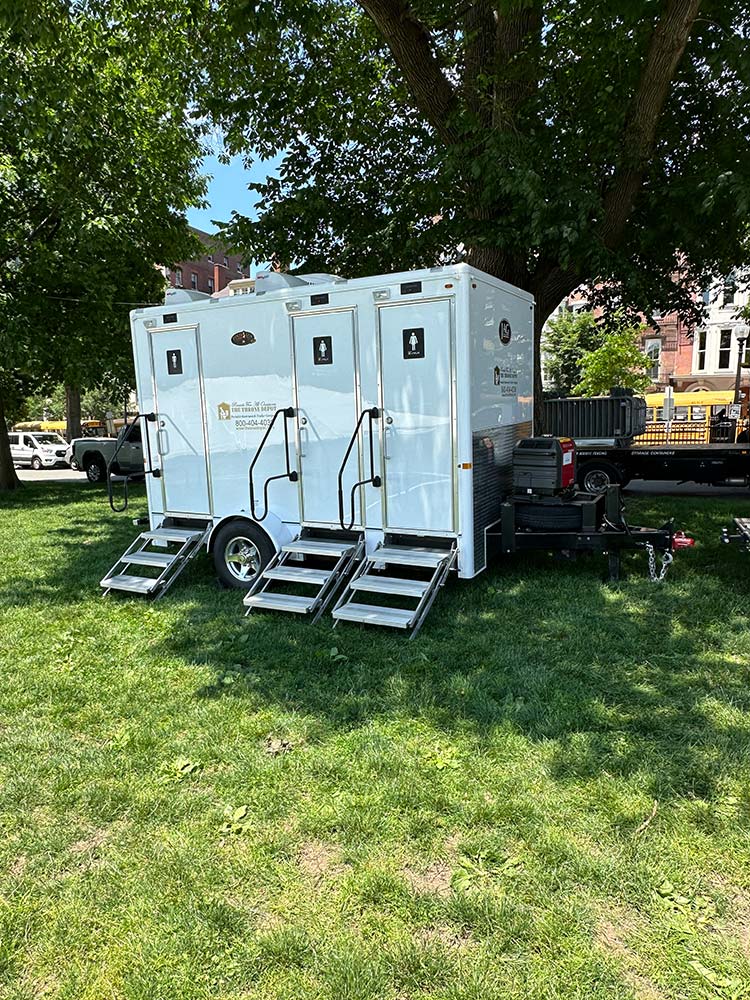 Restroom trailer exterior showing doors, steps, and setup features