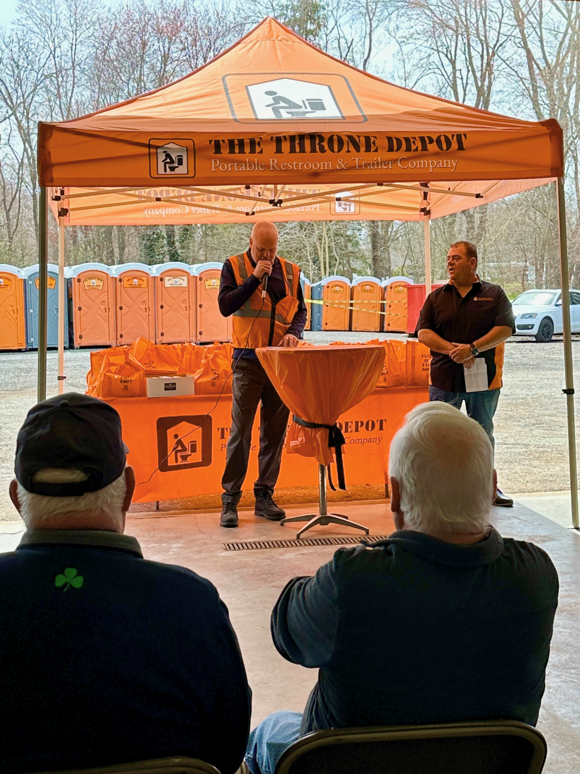 Speaker addressing attendees during The Throne Depot’s Rehoboth grand opening event