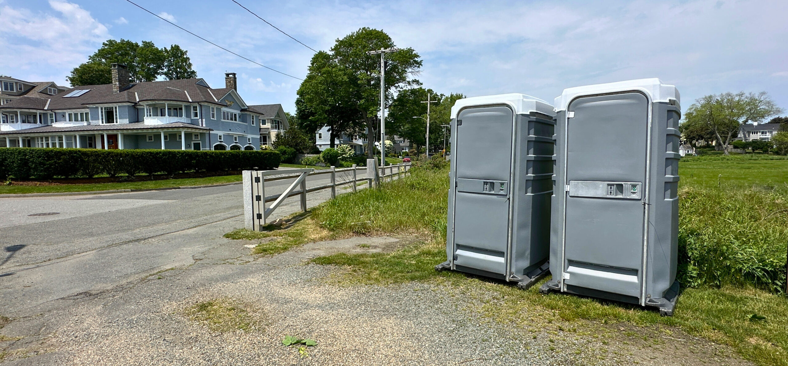 Two Luxury VIP portable toilets set up outdoors showing the upgraded exterior design