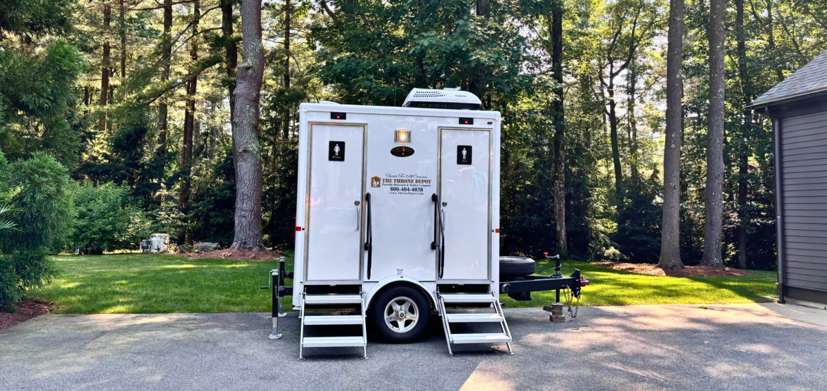 Two-stall luxury restroom trailer rental showing private stalls and upscale finishes for events and gatherings
