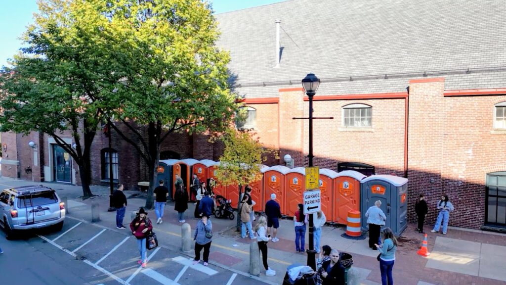 Portable restrooms set up along a public street in downtown Salem for Haunted Happenings