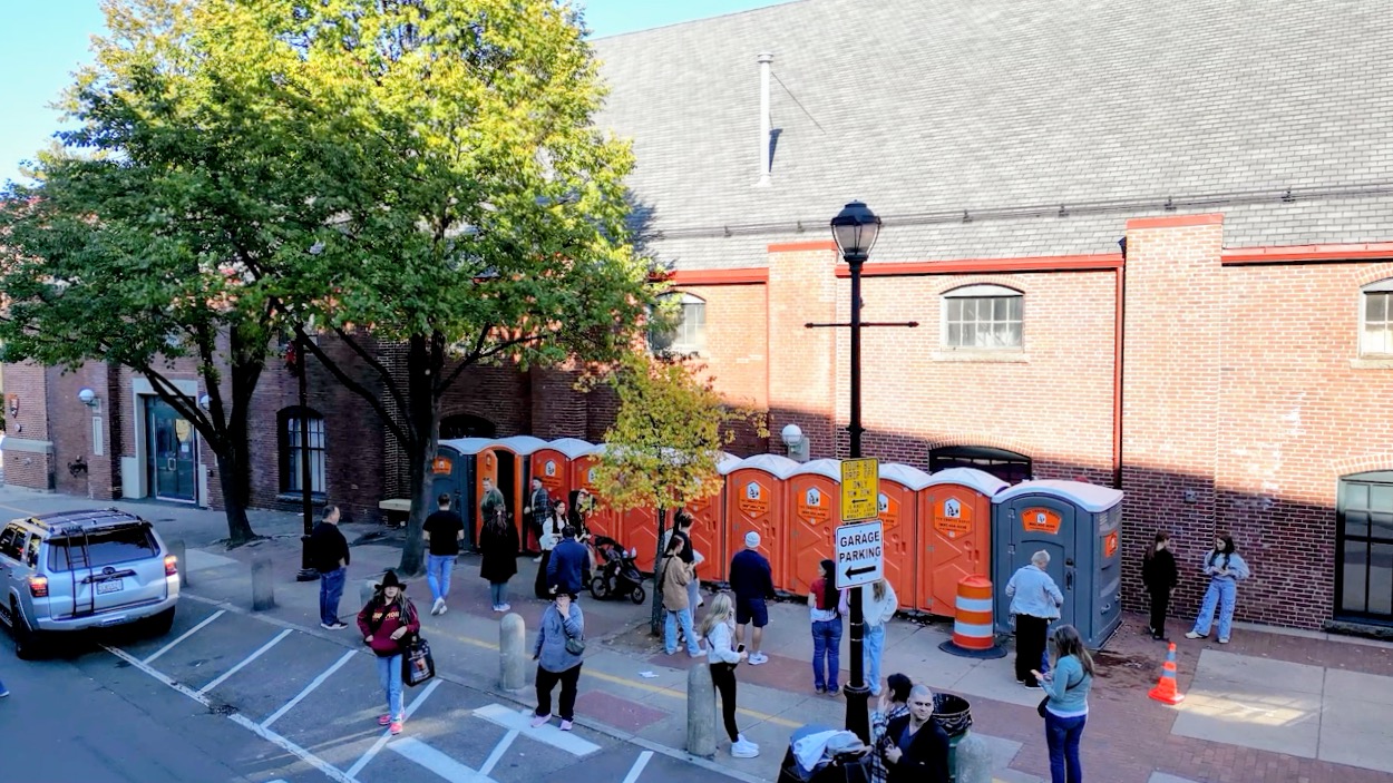 Portable restrooms set up along a public street in downtown Salem for Haunted Happenings