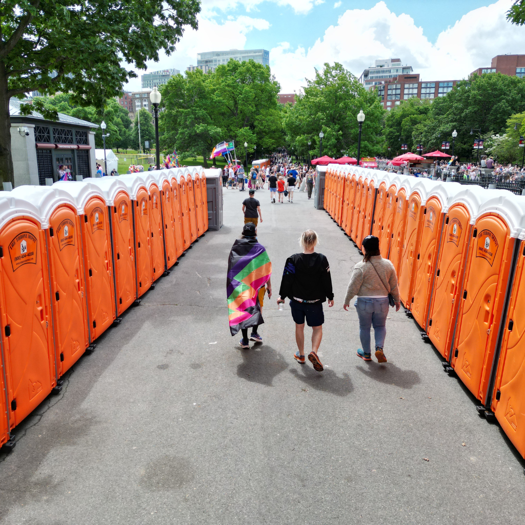 Portable toilets rental at a large outdoor event for guest sanitation