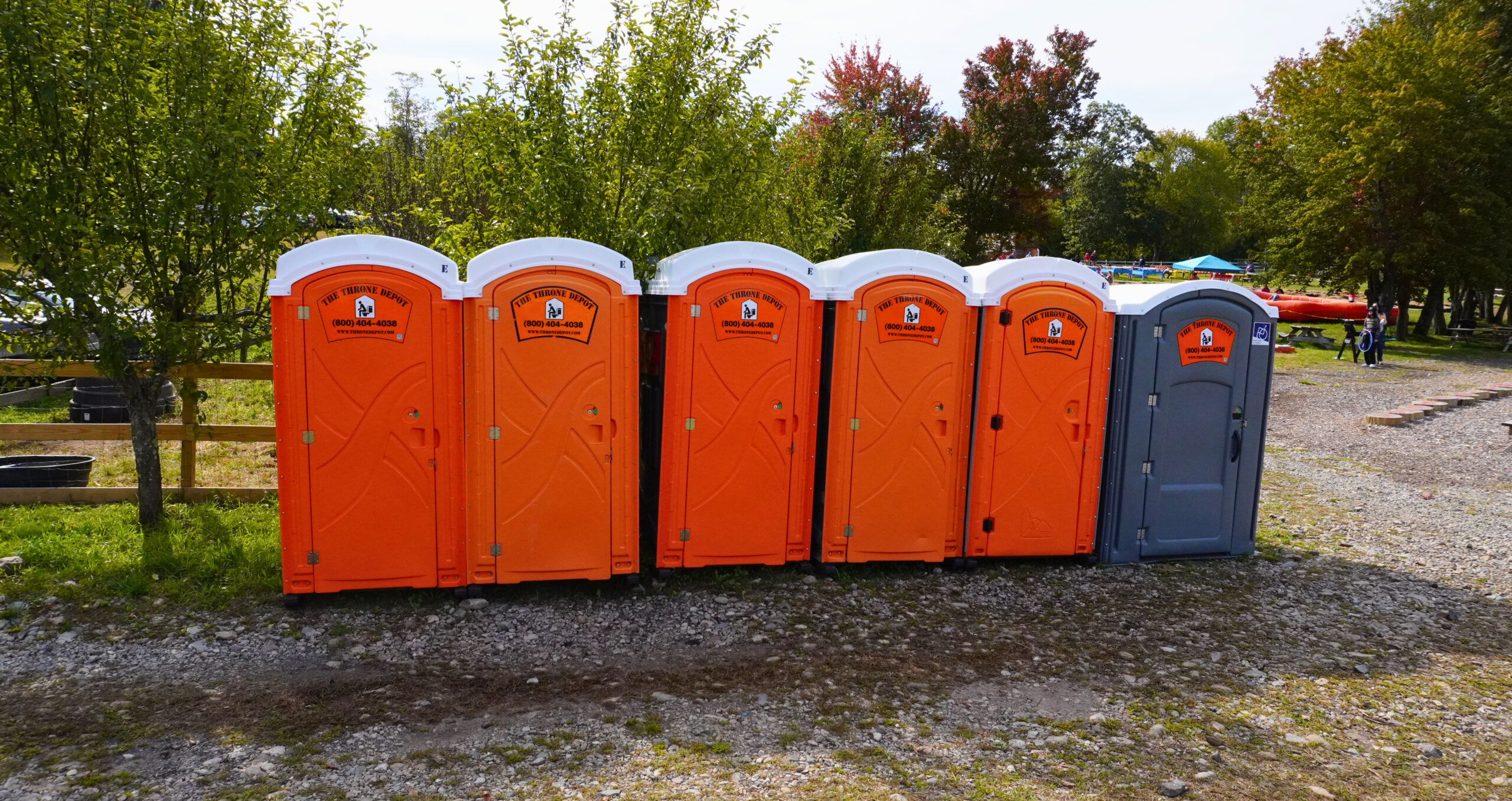 Portable restrooms including handicap accessible unit set up at a farm for visitors