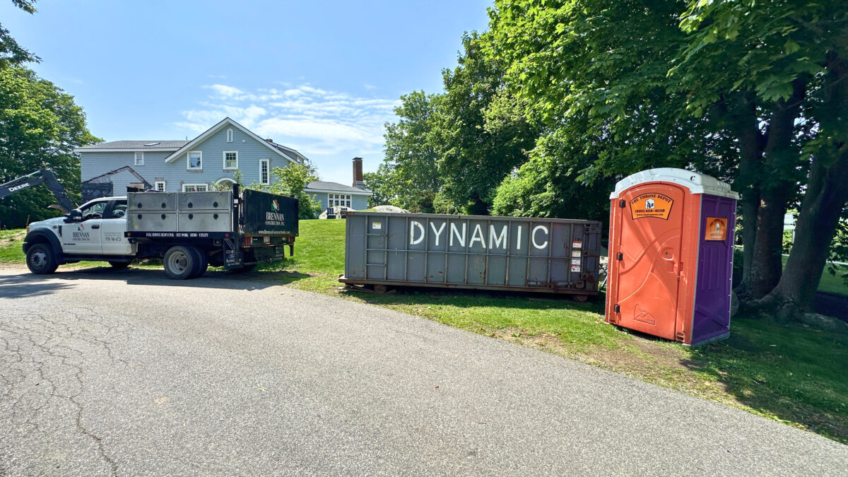 Portable toilet at a residential construction site demonstrating reliable jobsite restroom service.